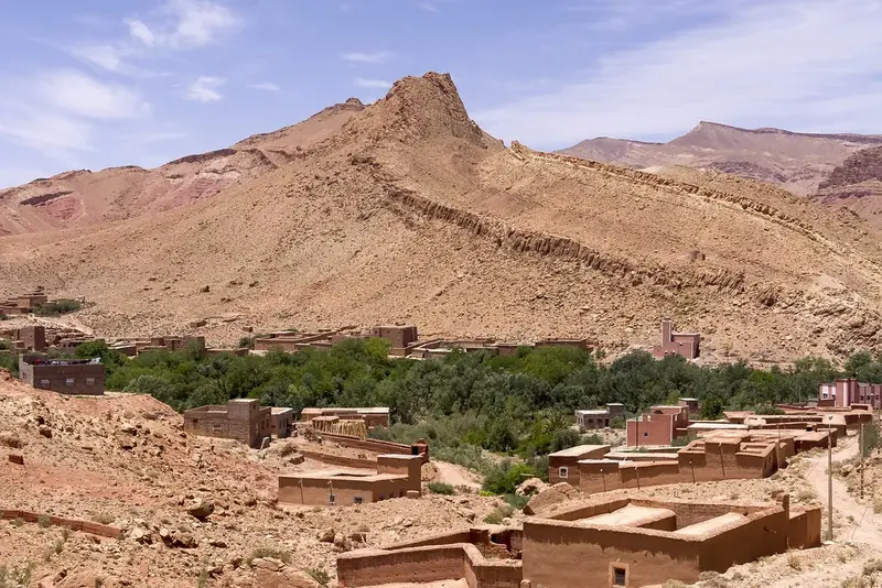 Valley with kasbahs and palms on the road to the Dades Gorges